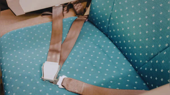 Sanitizing the seat belt and the rest of surfaces near your seat