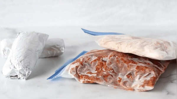 Get rid of the air to avoid freezer burn and freeze liquids flat