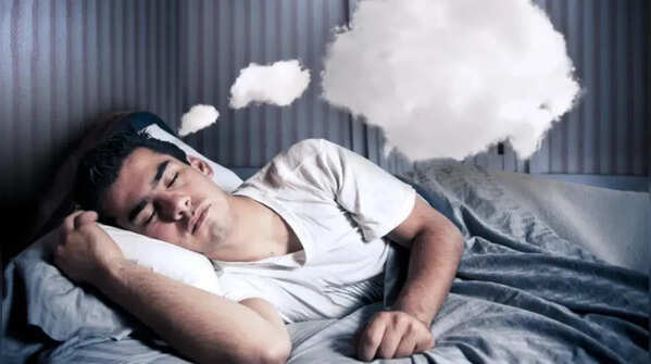 Why do snake dreams increase during stressful life phases?