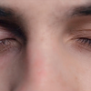 When should repeated eye twitching not be ignored?