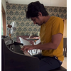 Piano set on a damask wallpaper