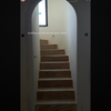 A two-storey closet with an arched entrance