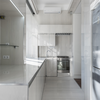 Use reflective materials like mirrors or glossy tiles
