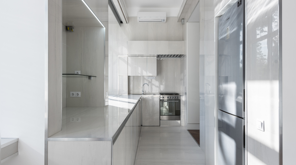 Use reflective materials like mirrors or glossy tiles