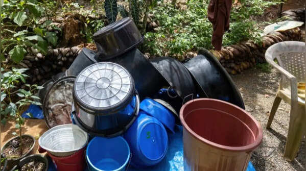 Neglected old buckets, cans, and other containers