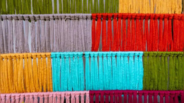 Use sheer dupattas as layered wall decorations