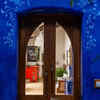 The charming verandah transitions into a stunning indigo entrance