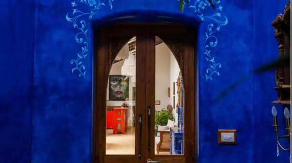 The charming verandah transitions into a stunning indigo entrance