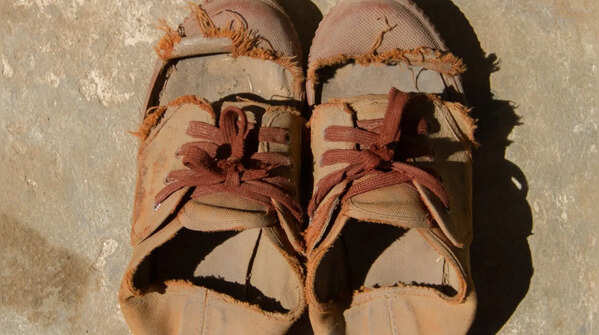 Torn shoes or damaged footwear