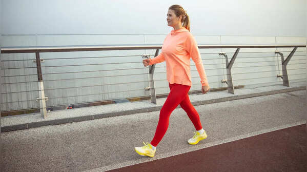 Why can walking alone not stimulate muscle growth?