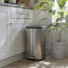 Place kitchen dustbins near cooking surfaces, but not close to food