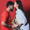 Anushka Sharma poses with Virat Kohli and the IPL trophy