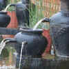 Turning old flower pots into small garden water features