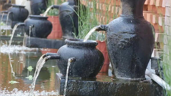 Turning old flower pots into small garden water features