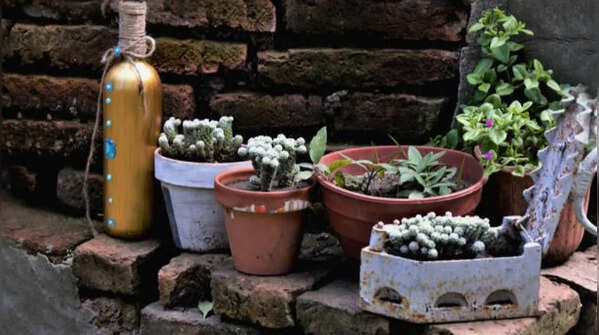 Using flower pots to store gardening items