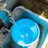 Buckets and bathtubs with water 