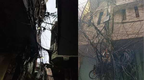 A maze of wiring casts shadows over by-lanes