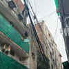 Tangled electrical lines loom over homes
