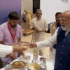 Article image for: Watch: PM Modi enjoys jhalmuri at NDA meeting served by Bengal CM Suvendu Adhikari