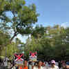 The protest venue inside Savitribai Phule Pune University show demonstrators holding posters and placards.