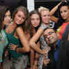 Emcee Virat Chhabra with the official IPL cheerleaders during a bash at ...