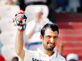 Pujara scores maiden Test ton