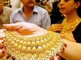 Gold falls to 10-month low on sustained selling