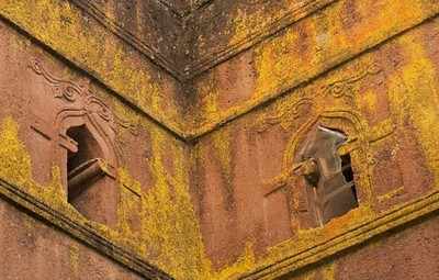 Priest in Bet Danaghel Church holding the Cross of King Lalibela. The  rock-hewn churches of Lalibela make it one of the greatest  Religio-Historical sites not only in Africa but in the Christian