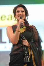 Nayanthara, who won the Best Actress award for her role in Raja Rani is seen here grinning from ear to ear as she accepts her award. But aside from the glee of having bagged the award, she's also going pink because Arya, from the audience, wouldn't stop calling out to her to mention his name in her acceptance speech. She thus ended saying that the award was dedicated "to the Raja of this film".