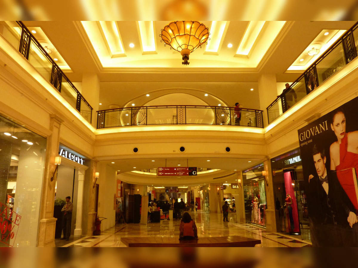 India - Delhi - A man walks through the DLF Emporio Mall