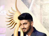 Arjun Kapoor poses with a trophy Photogallery - Times of India