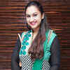 Article image for: <i class="tbold">preetha</i> Vijaykumar poses as she arrives for the premiere