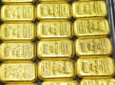 Gold slips in futures trade on global cues