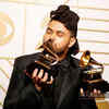 The Weeknd poses backstage with his awards for Best R&B Performance for 'Earned It' and Best Urban Contemporary Album for 'Beauty Behind the Madness' at the 58th Grammy Awards