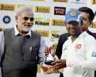 Gujarat Chief Minister Narendra Modi presents 'Man of the Match' award to Sri Lankan cricketer Mahela Jayawardene