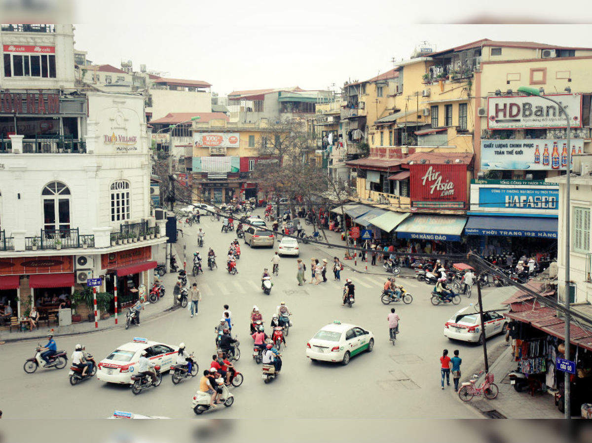 Crossing the road in Hanoi's old quarter, Hanoi, Vietnam Stock