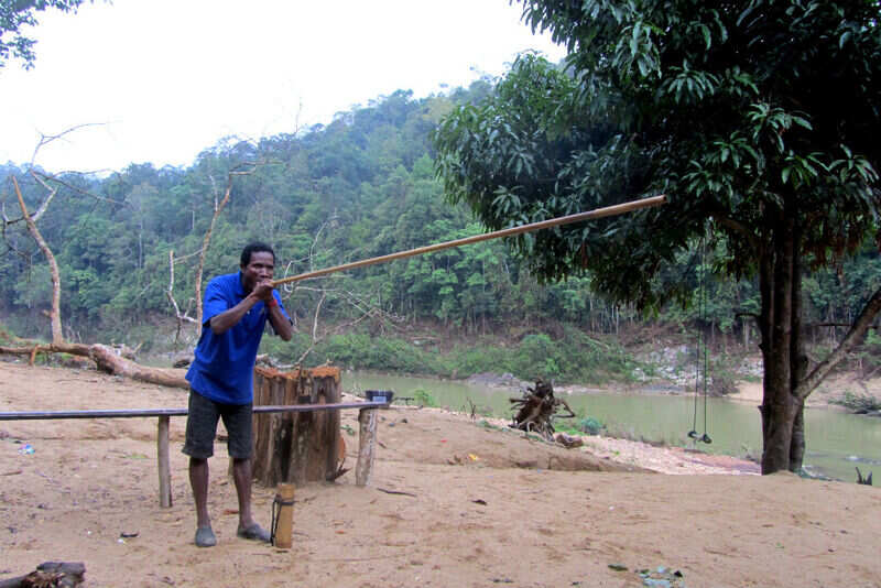 The Orang Asli tribals showing the bamboo hunt pipe 