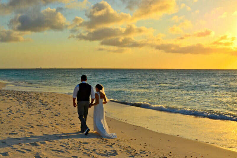 Wedding-Couple-Walking-on-Eagle-Beach-at-Sunset-3