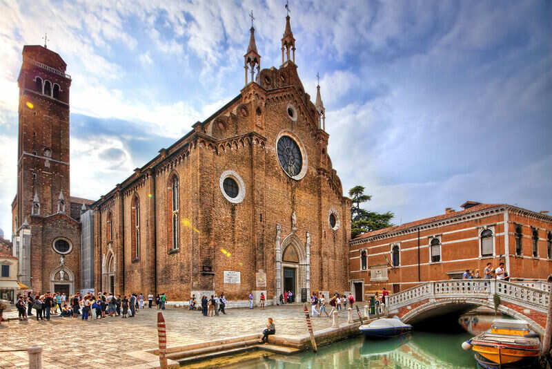 Stroll around the medieval church of Santa Maria Gloriosa Dei Frari