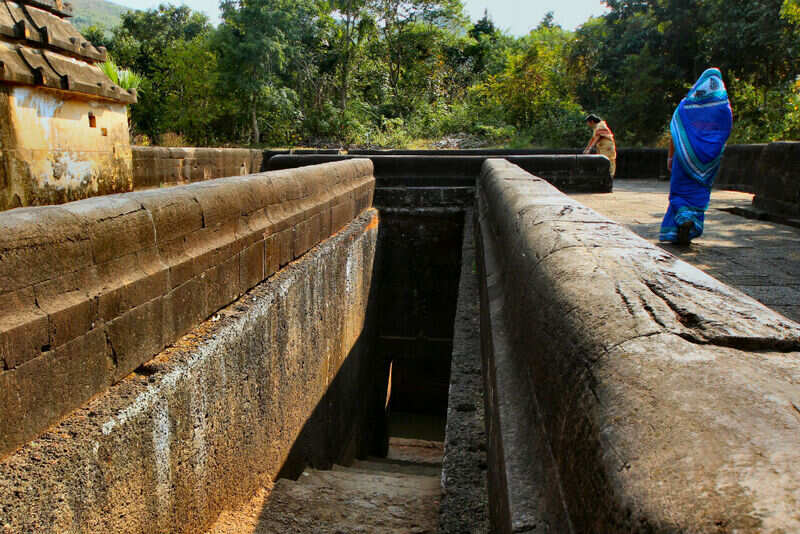 Visitors exploring the Rock Cut Stepped Well (9th-10th Century A