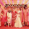 Neil and Rukmini pose together with their guests at the mehendi ceremony