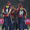Article image for: Ashish Nehra of DD celebrate after taking the wicket of <i class="tbold">Naman Ojha</i> of RR