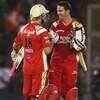Article image for: Kevin Pietersen of RCB celebrates with <i class="tbold">Cameron White</i>