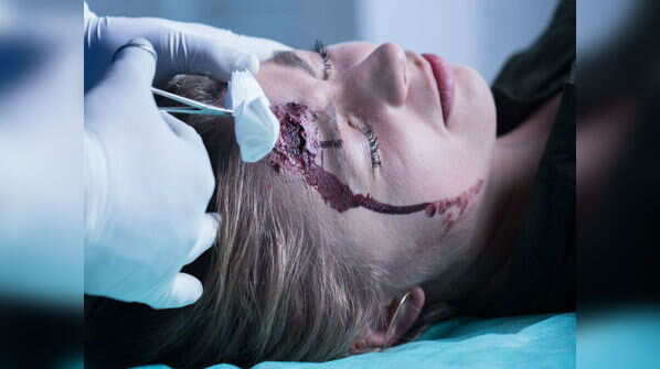 Do not remove the debris or anything that is sticking to the wound
