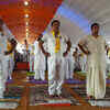 CM Sarbananda Sonowal, Minister Himanta Biswa Sarma and Acharya Balkrishna perform Yoga in Guwahati