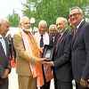 PM Modi greets crowd as he visits a temple in Lisbon, Portugal