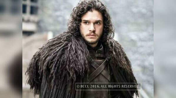 What does Melisandre burn during Jon Snow's resurrection ritual?