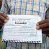 Parent's of one of the victim child holds his death certificate