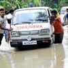 An ambulance breaks down on flooded NH 37 at Jakhalabandha in Assam