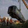 The upturned coach is being removed